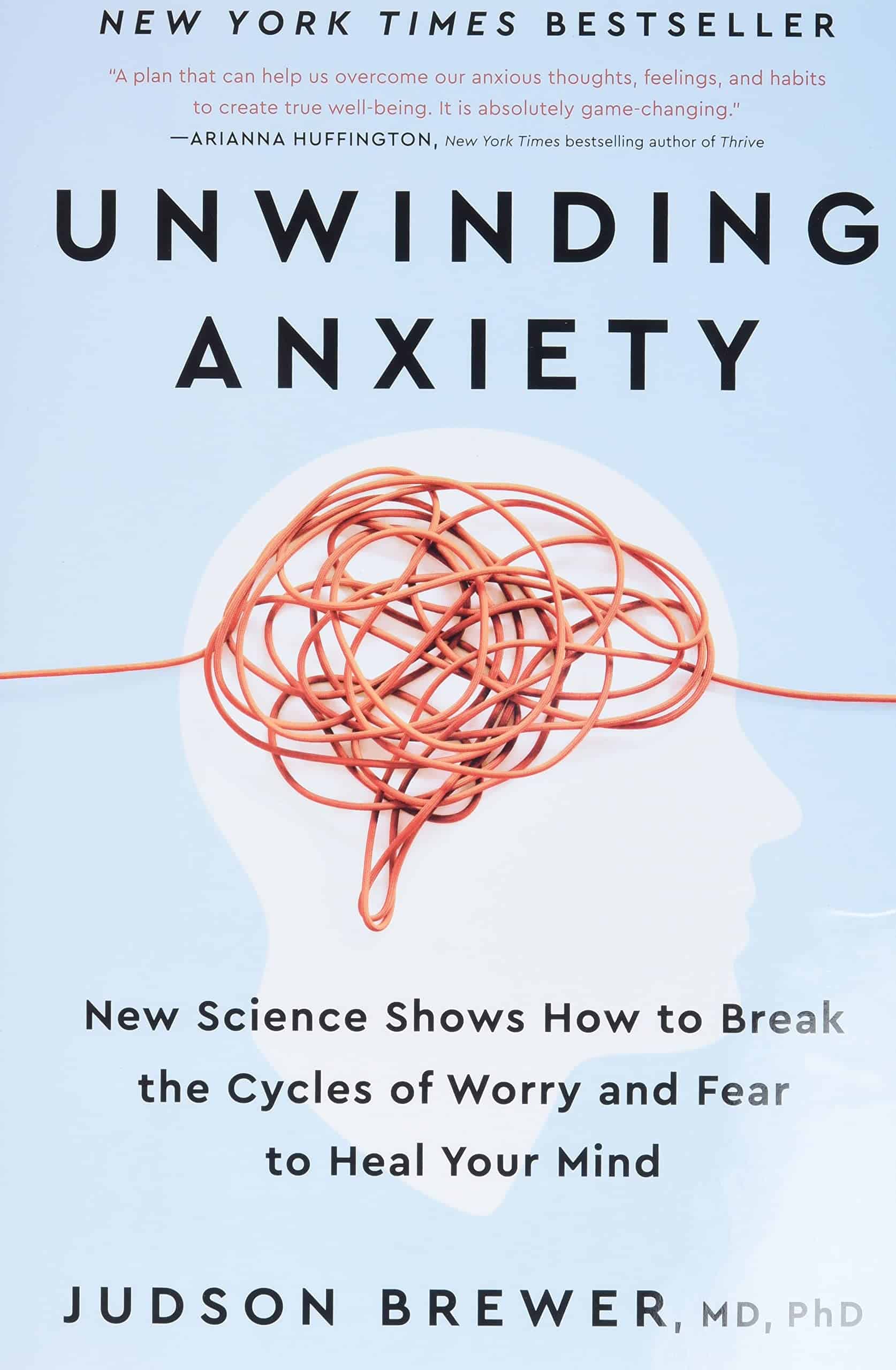 Book cover of 'Unwinding Anxiety' by Judson Brewer featuring a silhouette of a head with tangled orange cord inside representing the brain.