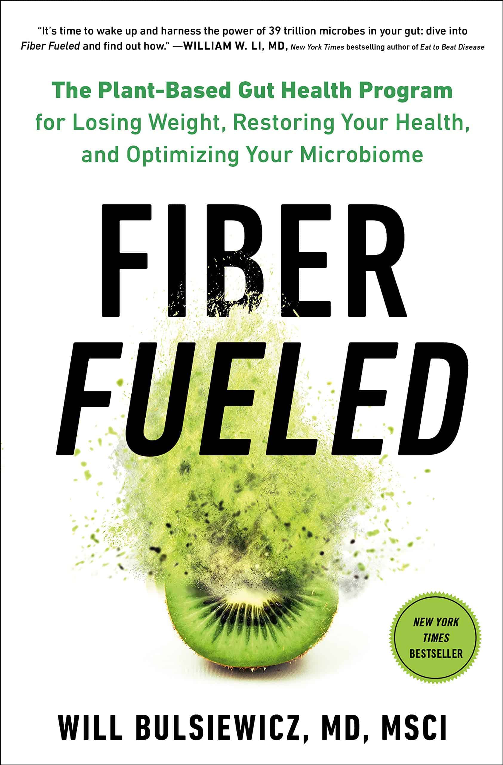 Book cover of Fiber Fueled by Will Bulsiewicz featuring a sliced kiwi with green powder exploding above it.