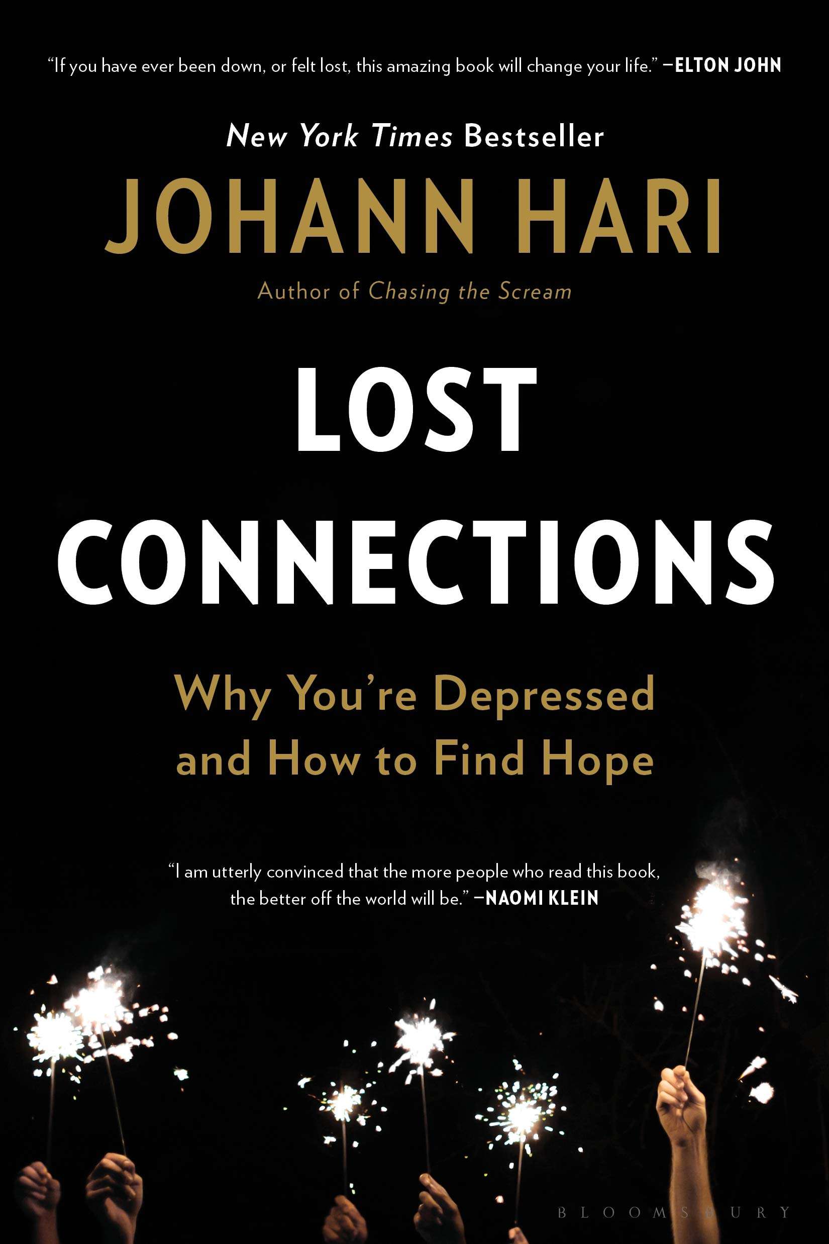 Book cover for Lost Connections by Johann Hari, featuring sparklers held by multiple hands against a black background.