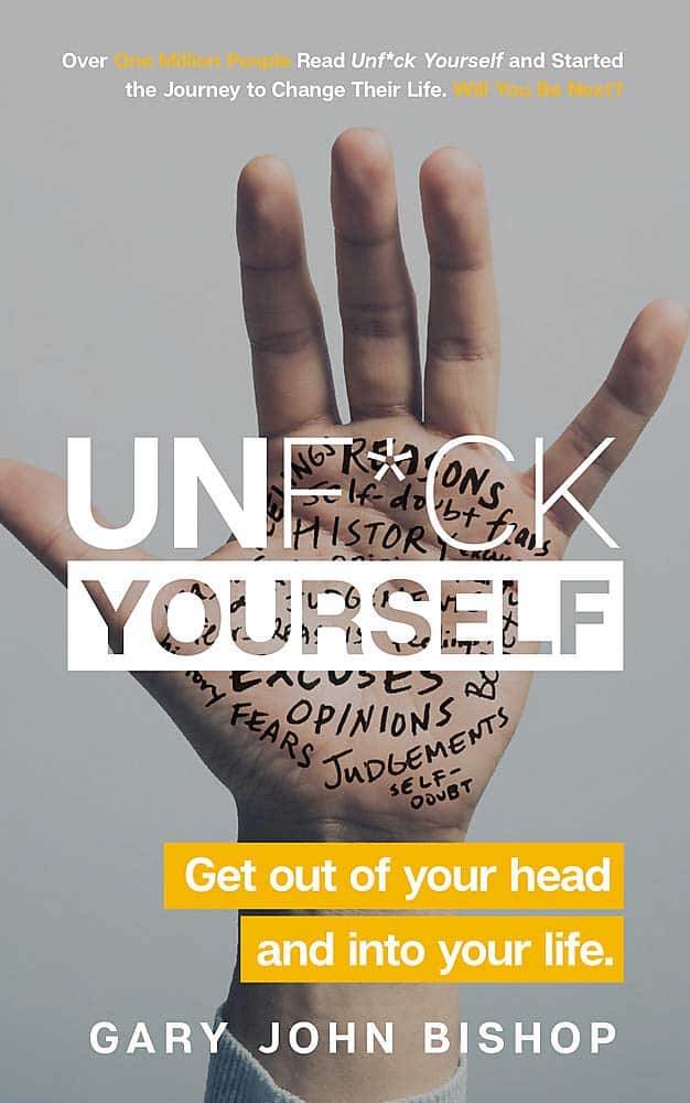 Open hand with words like 'excuses,' 'opinions,' and 'self-doubt' written on the palm, overlayed by text 'Unf*ck Yourself' and 'Get out of your head and into your life' by Gary John Bishop.
