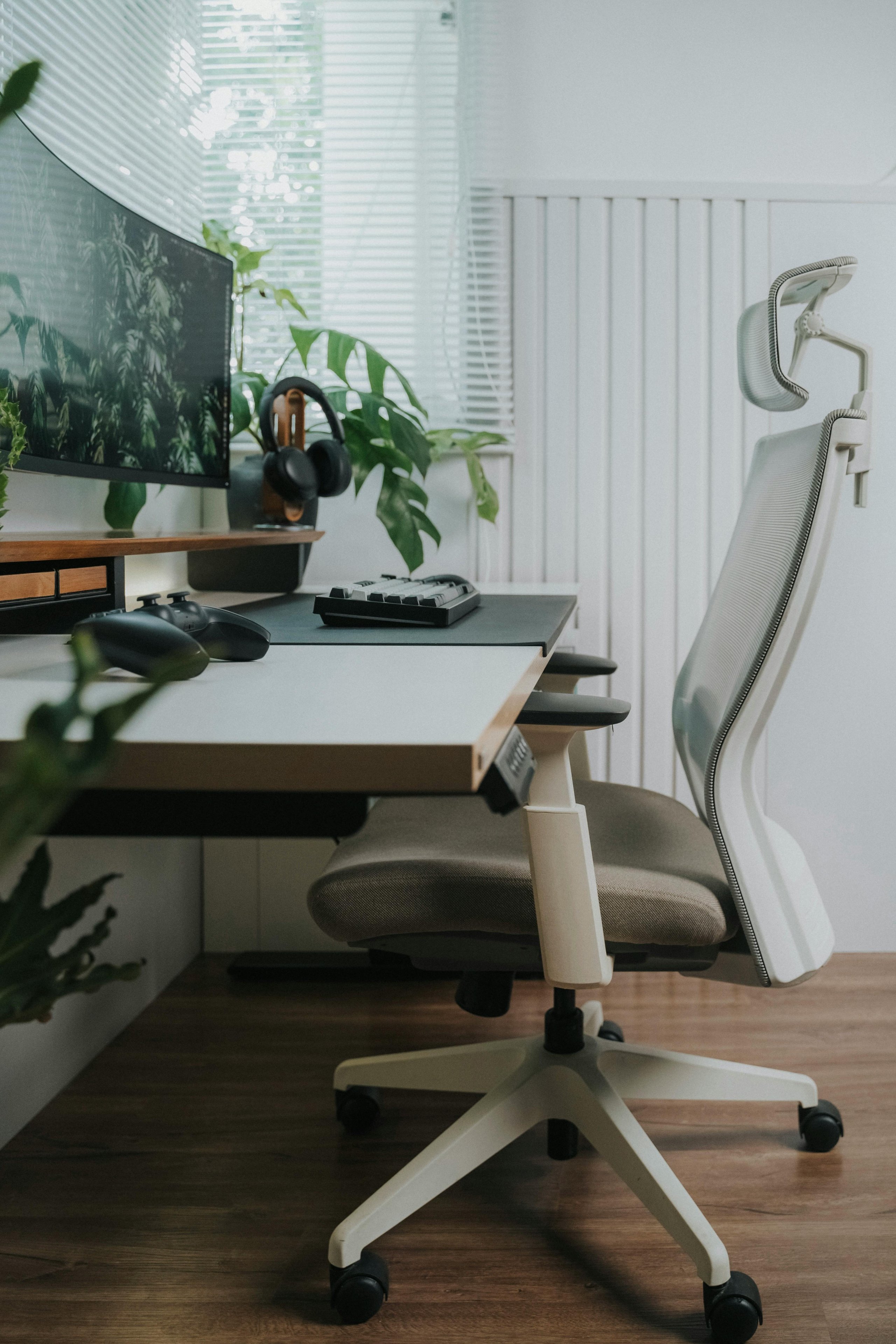 a closeup of an ergonomic modern desk with a chair and computer