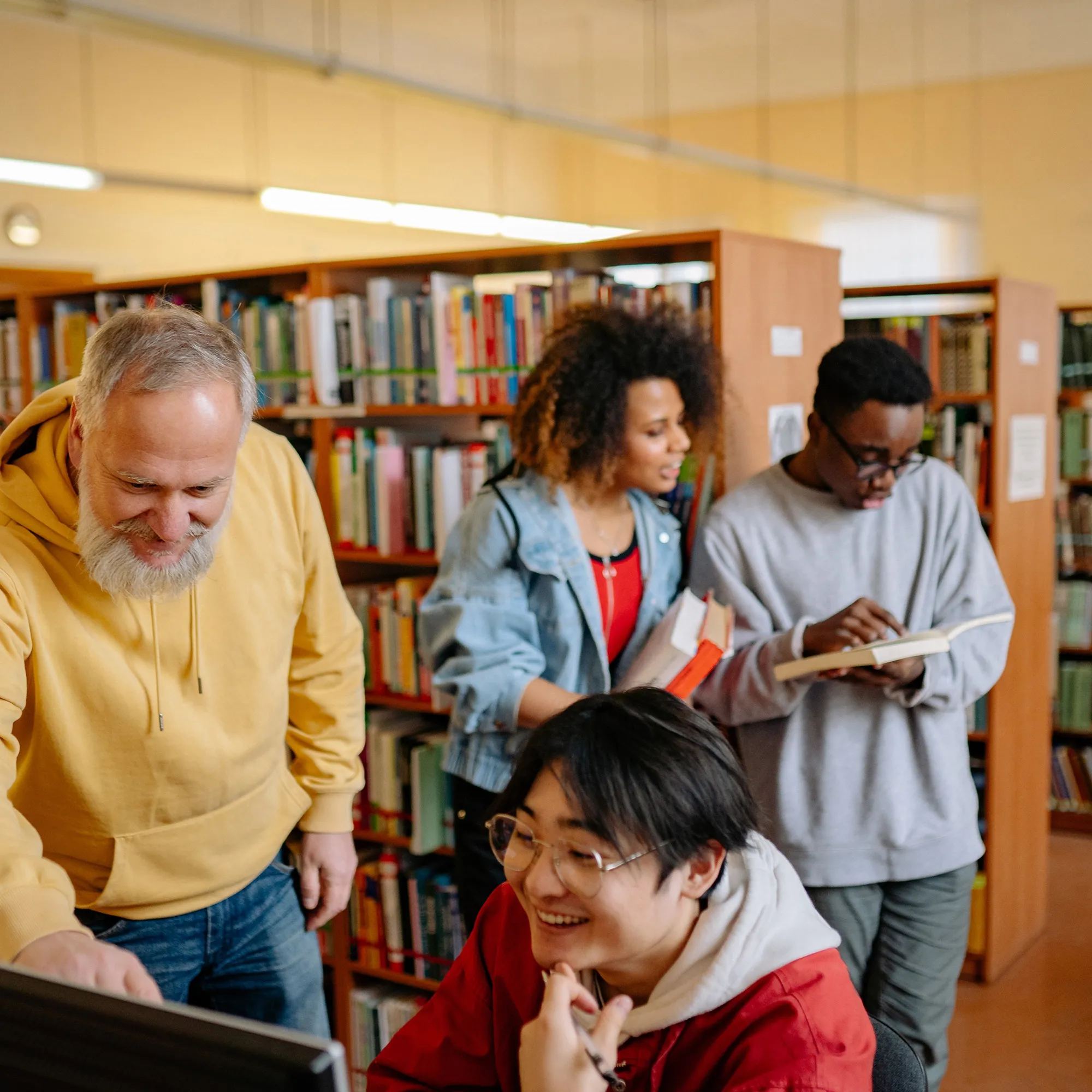 Teacher with students in library