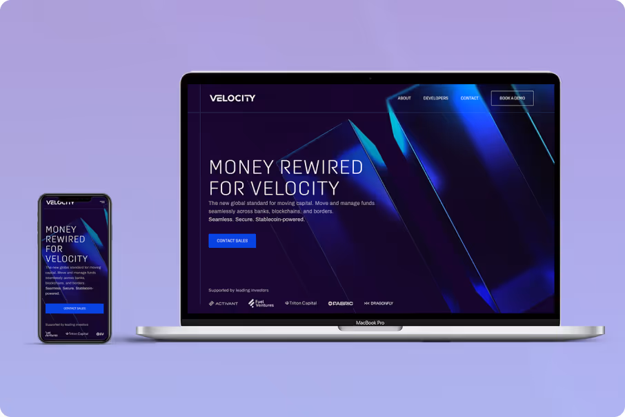 Laptop and smartphone showing Velocity website with headline about moving and managing funds globally.