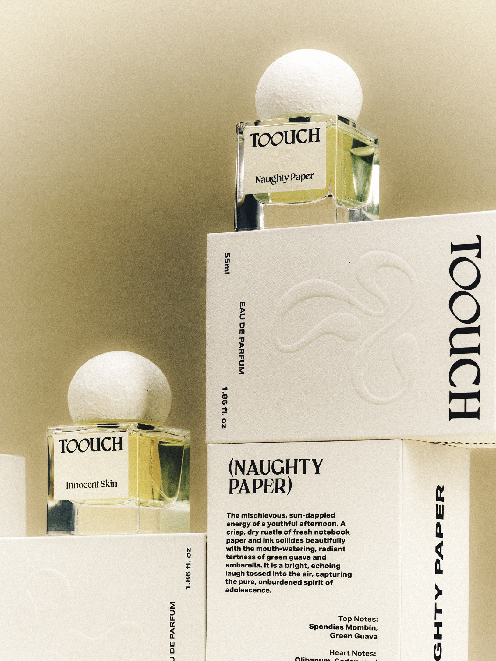 Toouch Scent perfume bottles and packaging in a studio still life