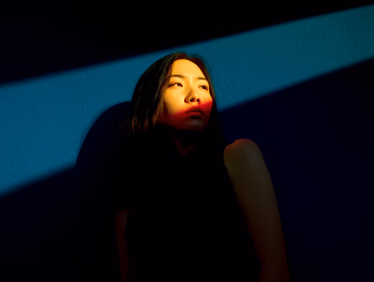 Two classic sports cars parked in front of a building.