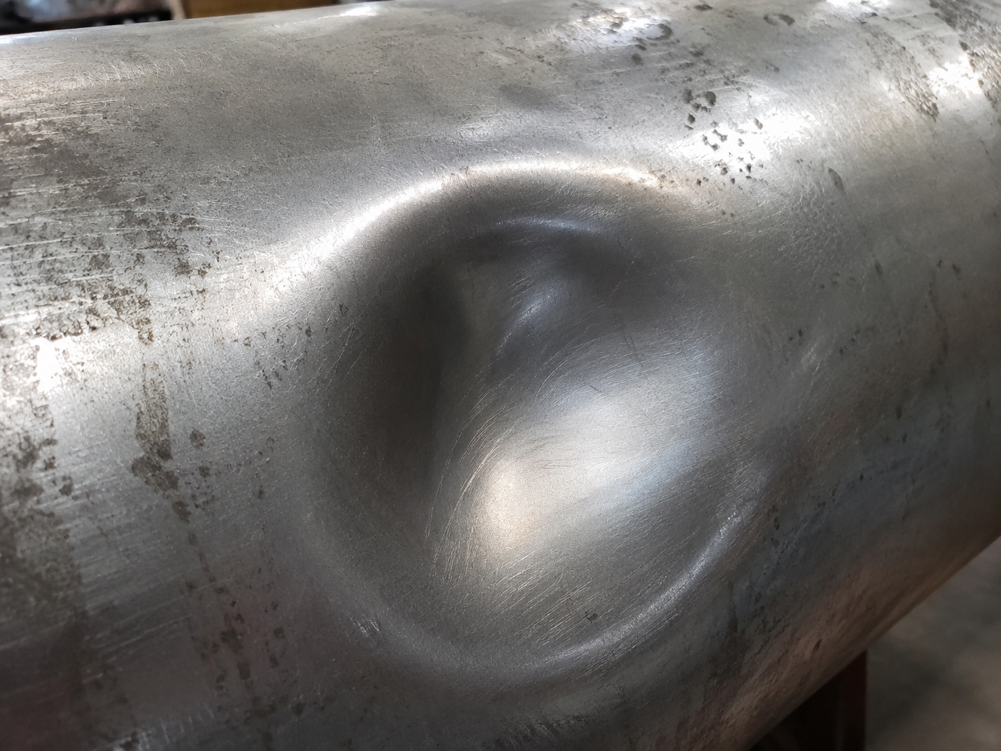 Pipeline dent — geometric deformation defect detected by caliper inspection