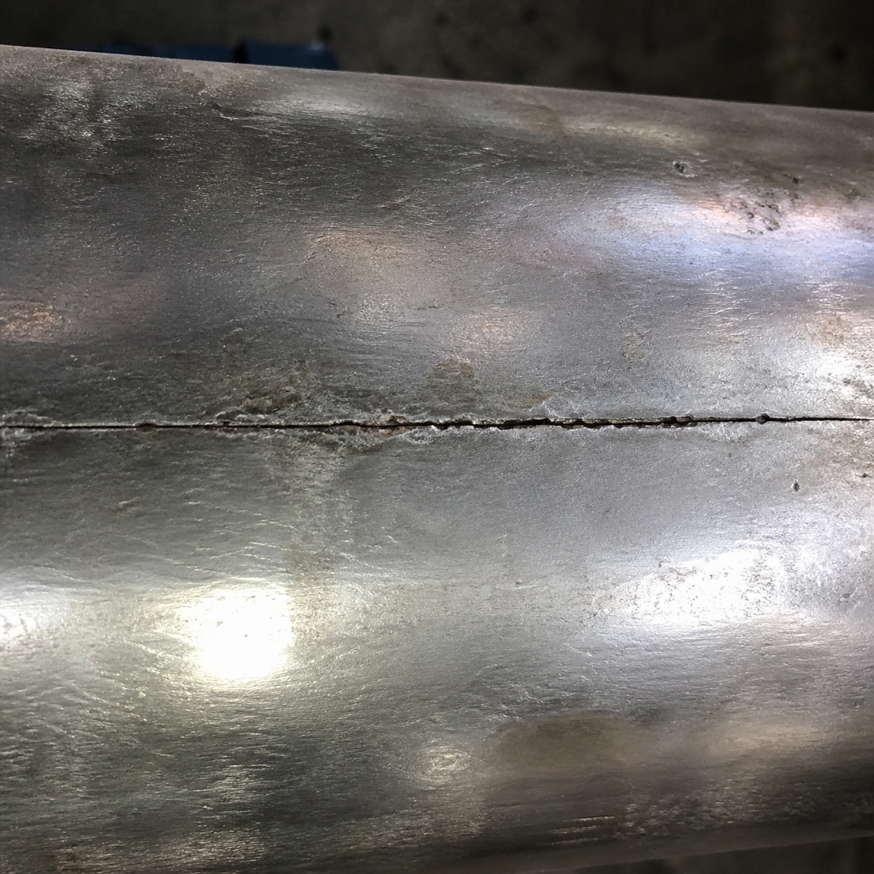 Axial crack-like feature along a pipeline longitudinal seam weld