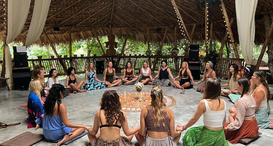 Group meditation circle in open-air shala at Shivari retreat