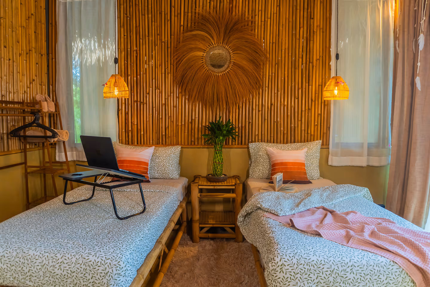 Art Room interior with bamboo walls, twin beds and workspace