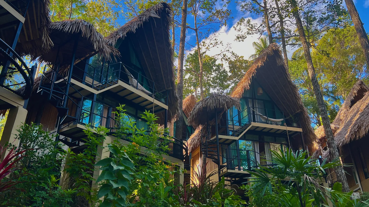 Macrame hammock on balcony overlooking jungle
