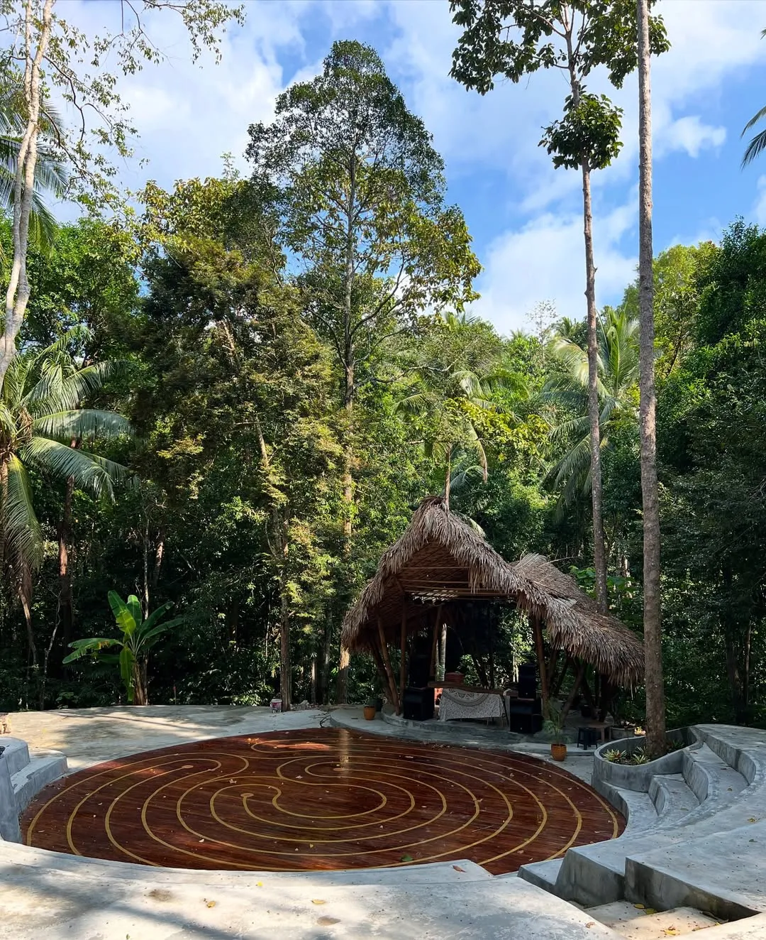 Thatched roof gazebo nestled in dense jungle