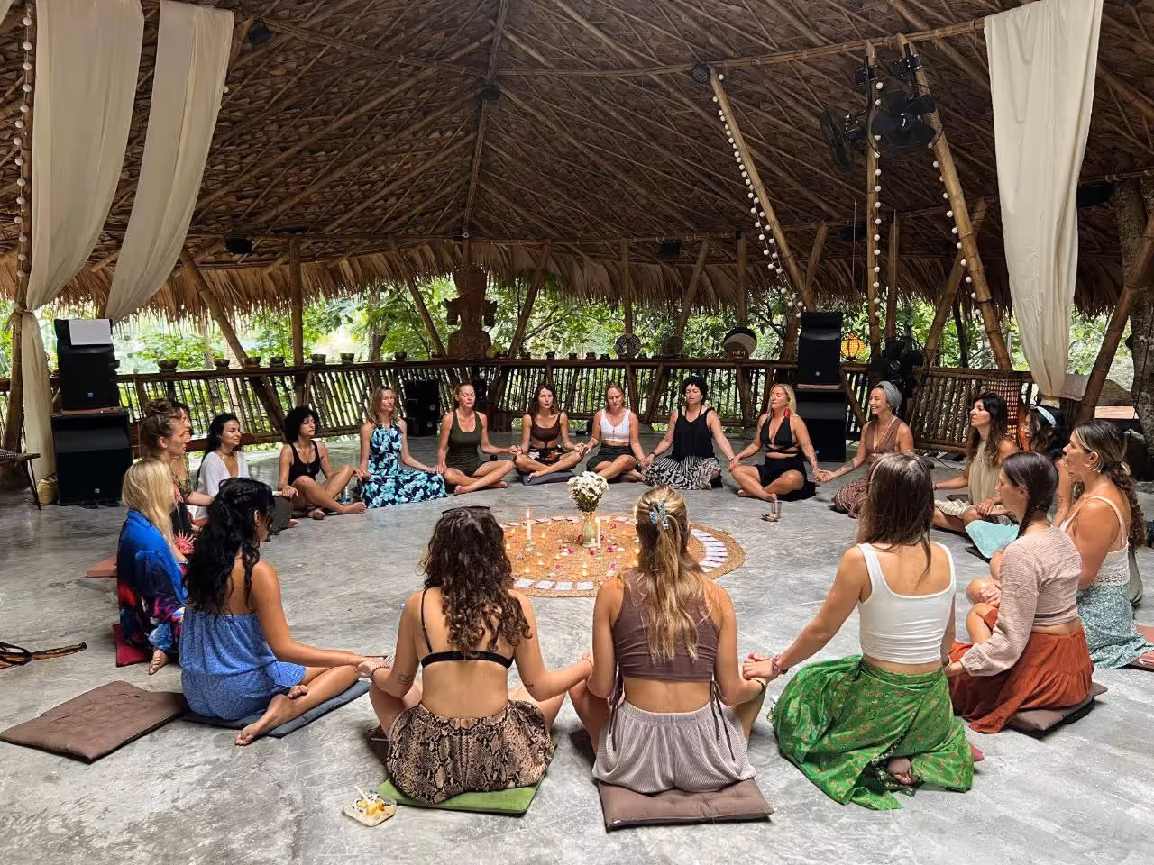 Women sitting in circle during gathering in dome shala at Shivari retreat