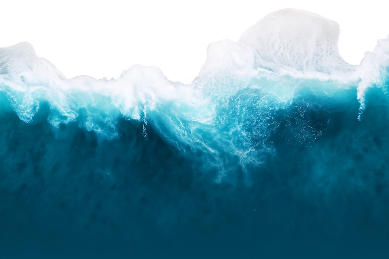 Aerial view of ocean waves crashing with white foam and deep blue water.