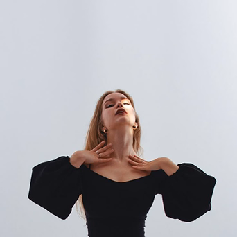 Woman posing confidently on white background