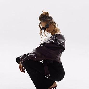 Woman posing confidently on white background