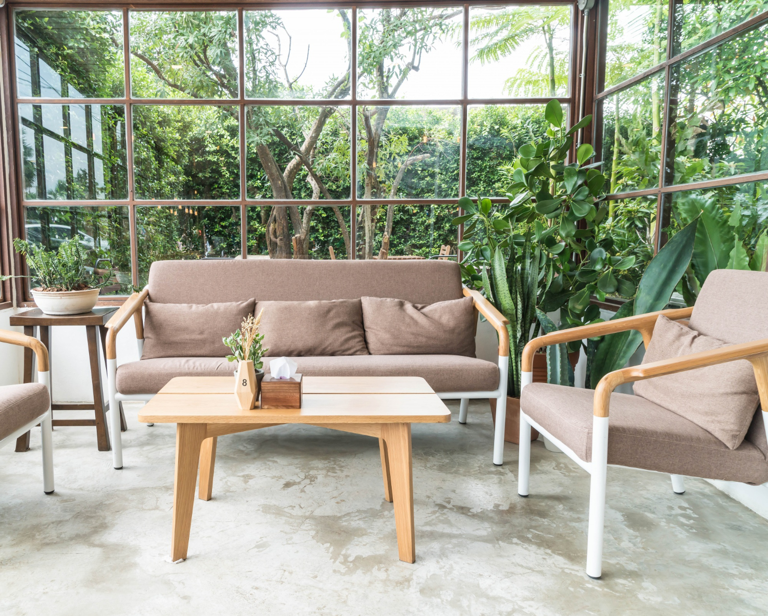 Outdoor patio hardscape construction with concrete floors and garden seating
