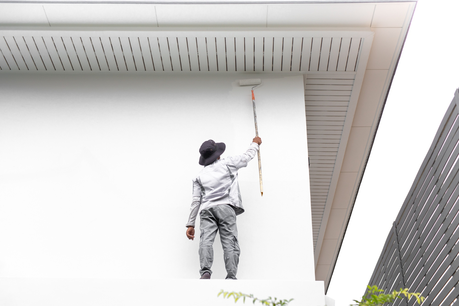 Exterior remodeling contractor painting home facade in Los Angeles
