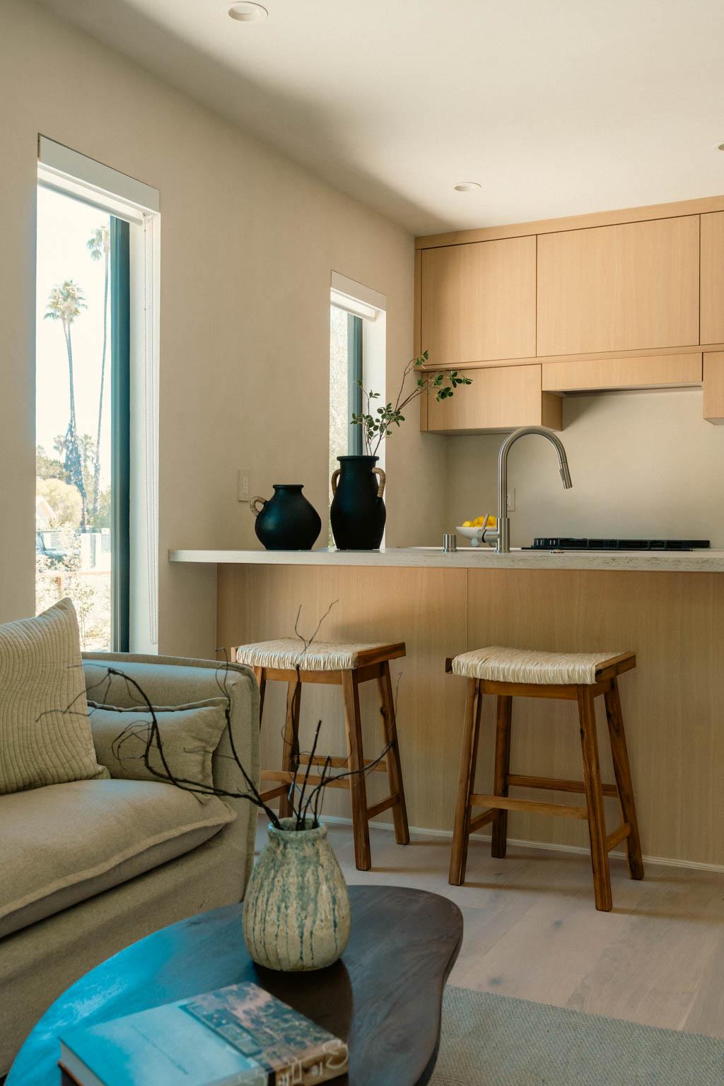 ADU interior Los Angeles with open plan kitchen, wood cabinets and natural light
