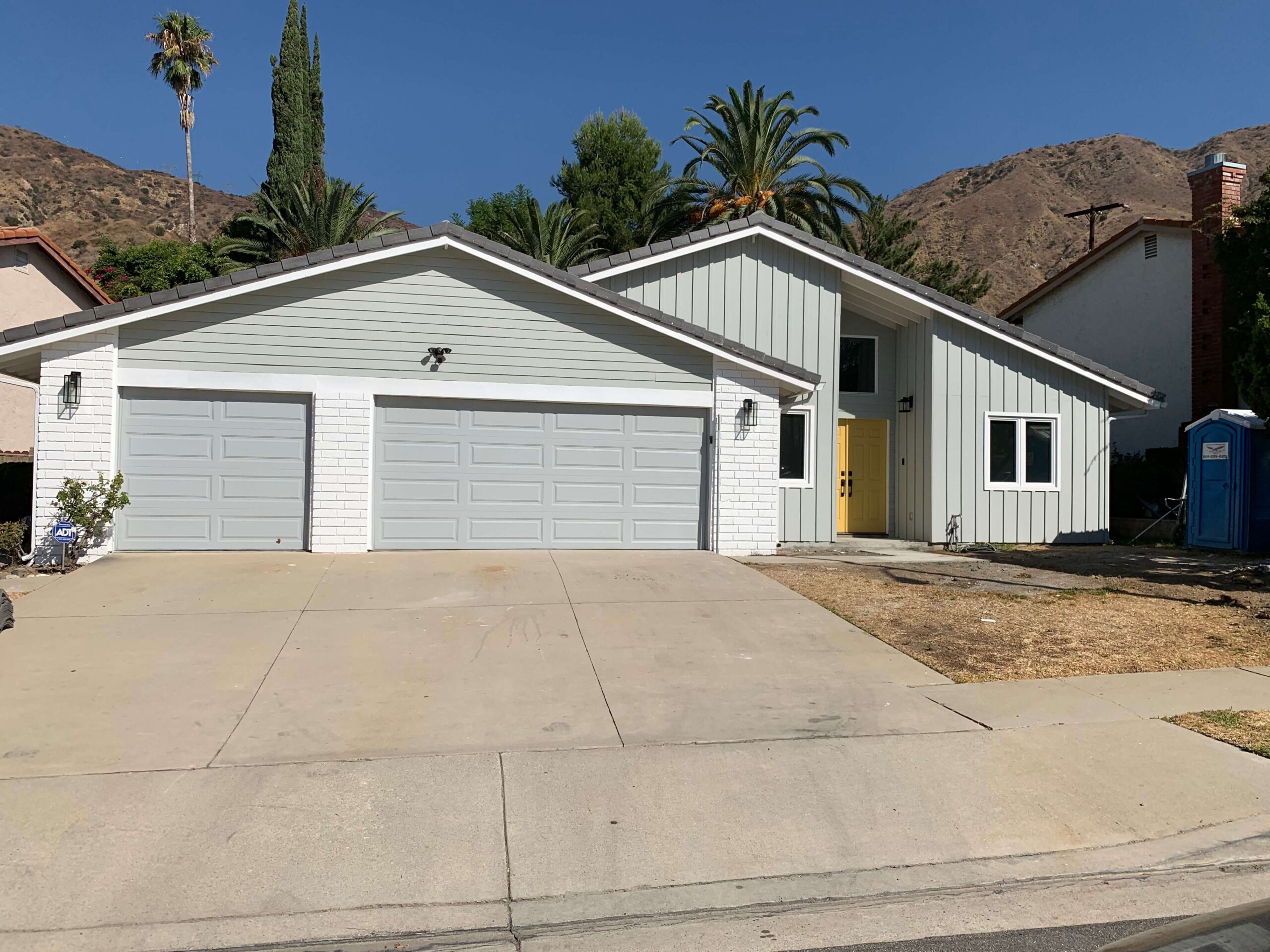 Garage renovation Los Angeles with new garage doors and fresh exterior finish