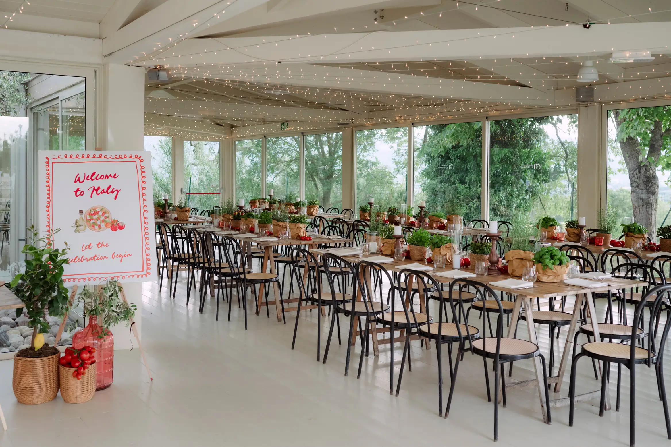 Italian-themed dining room with string lights, tables