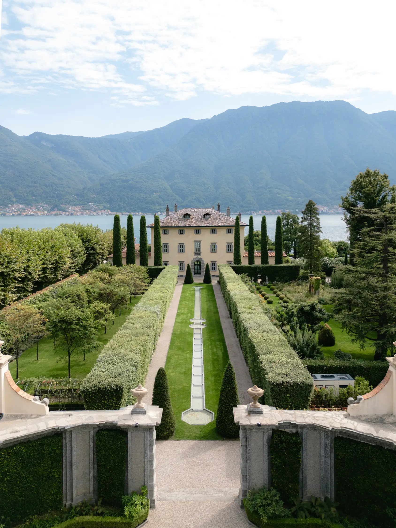 Elegant Italian villa with geometric gardens overlooking Lake Como and mountains