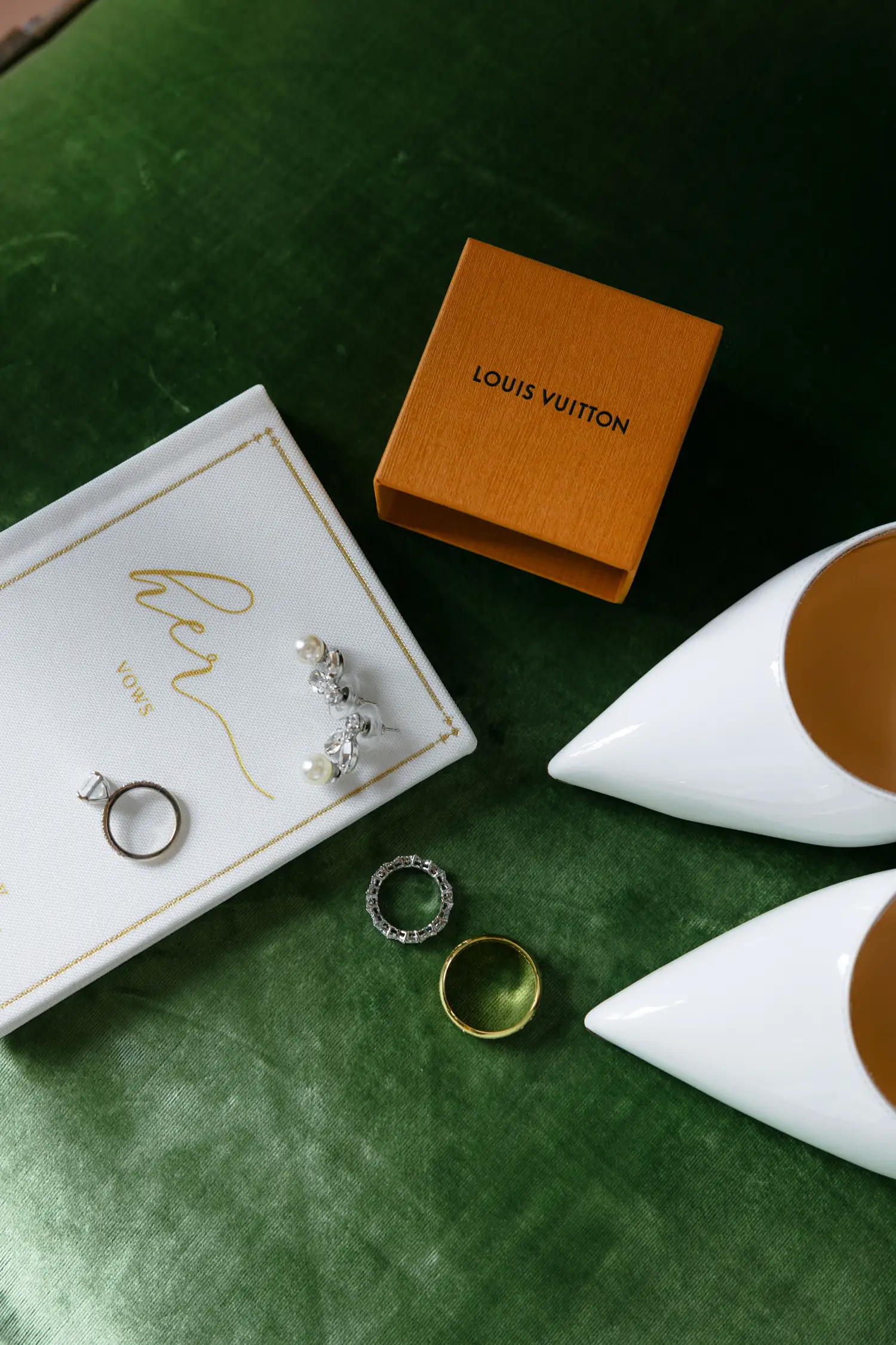 Louis Vuitton wedding accessories with rings, jewelry, and white shoes