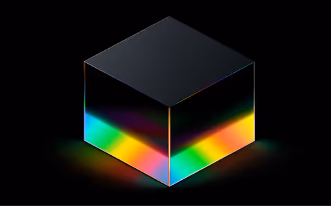 Black cube with glowing rainbow-colored edges on a black background.