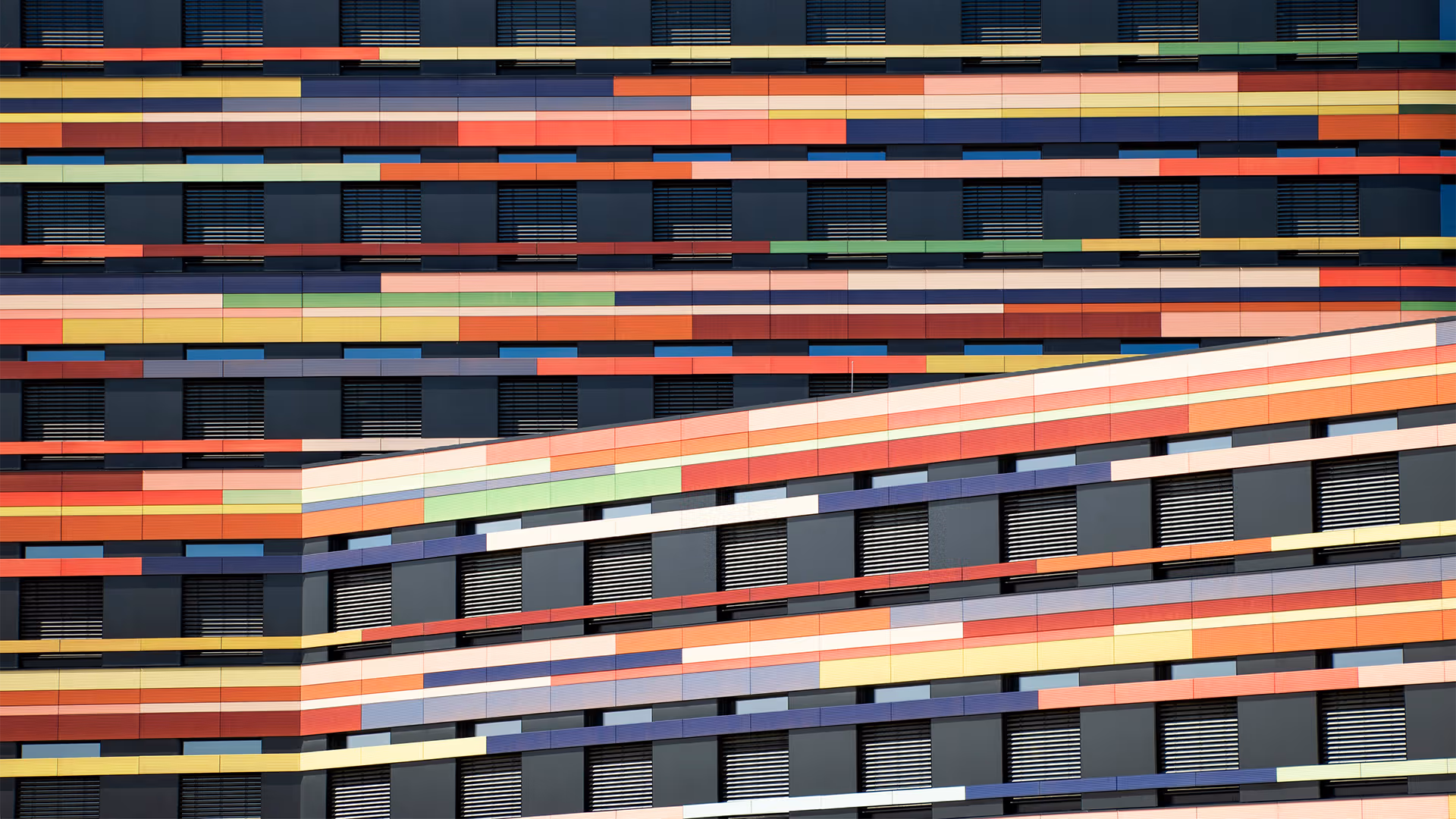 Colourful geometric building facade representing the complexity and diversity of human insight