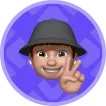 Emoji-style face of a person wearing a gray hat making a peace sign with their right hand on a purple background.