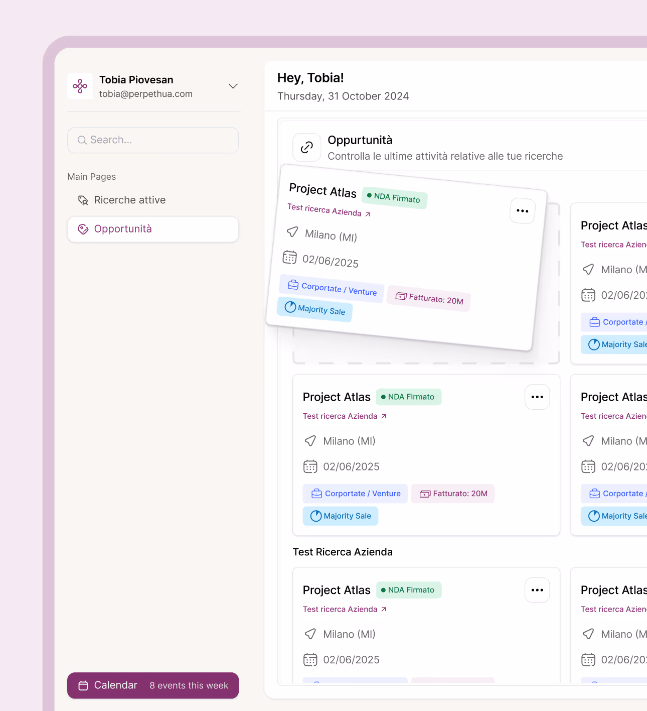 Dashboard interface showing user Tobia Piovesan's email, a search bar, menu with active searches and opportunities, and cards listing Project Atlas details including location Milano, date 02/06/2025, NDA signed status, and tags for Corporate/Venture, Revenue 20M, and Majority Sale.