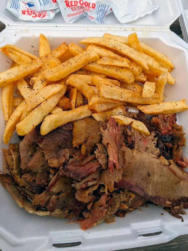 French fries and a big portion of special ham slow-baked and grilled