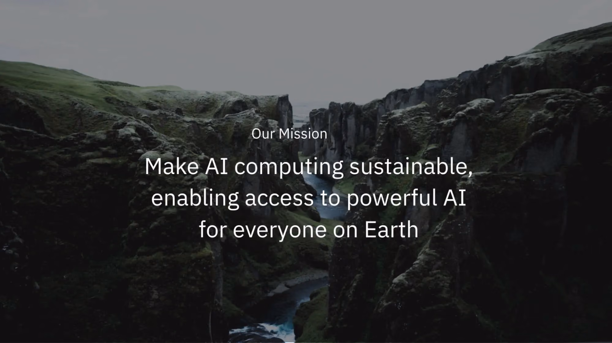 Landscape of a dramatic green canyon with a river below, overlaid with text stating Furiosa’s mission to make AI computing sustainable and accessible worldwide.