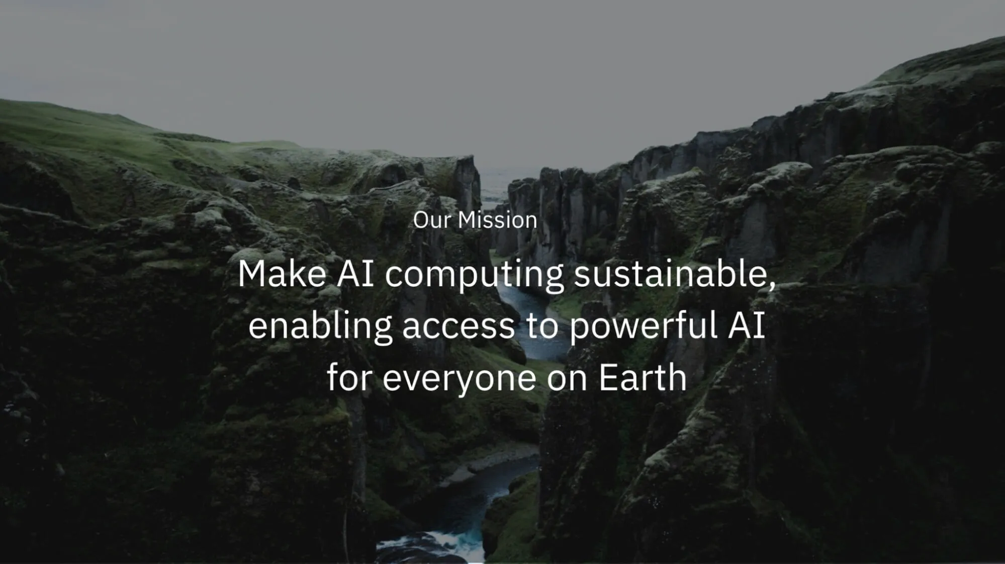 Landscape of a dramatic green canyon with a river below, overlaid with text stating Furiosa’s mission to make AI computing sustainable and accessible worldwide.