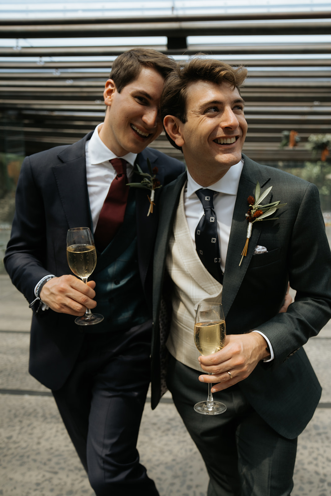 Elegant outdoor wedding setup with round tables, gold chairs, white floral arrangements, and hanging crystal chandeliers.