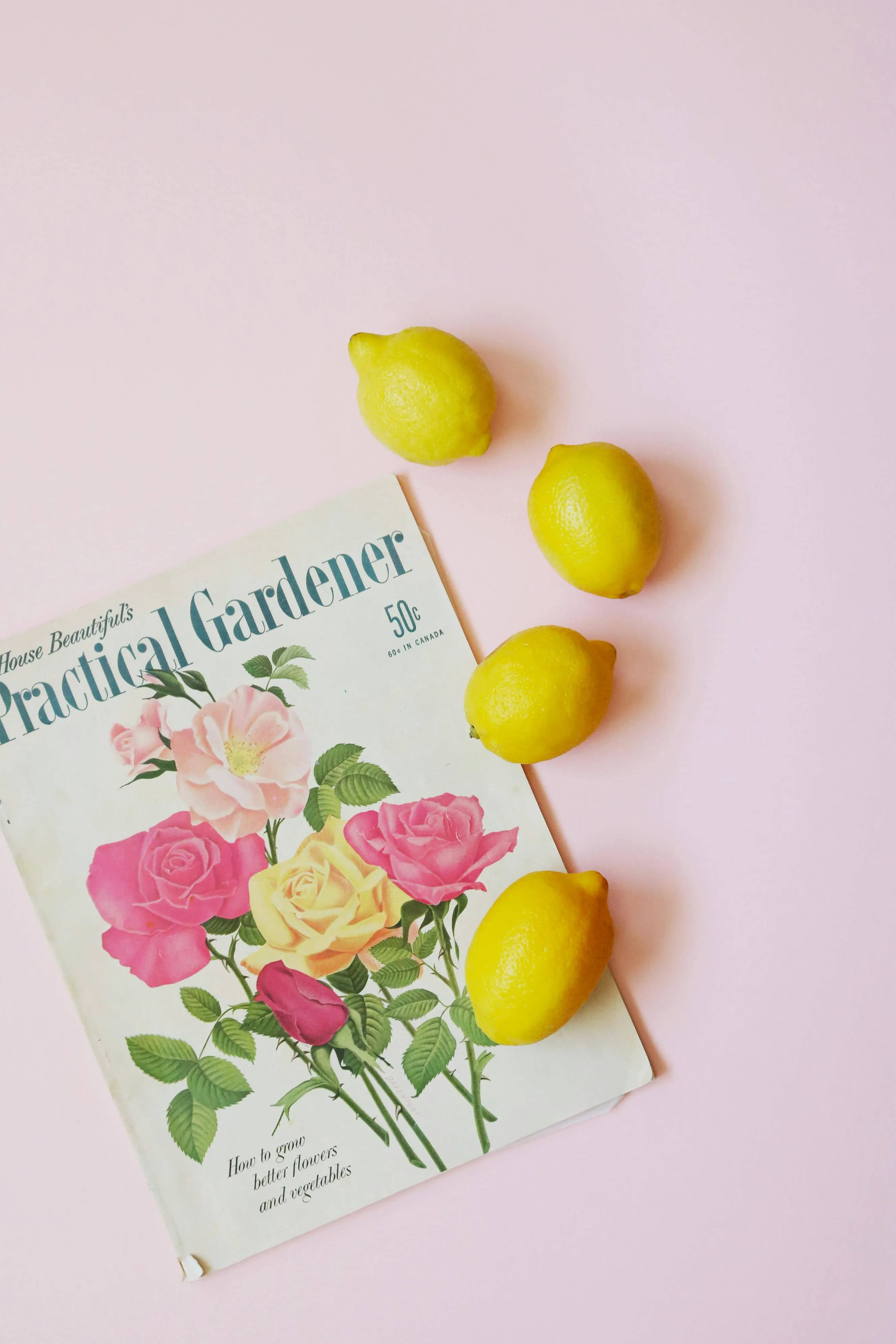 a magazine with 4 lemons laid out around it