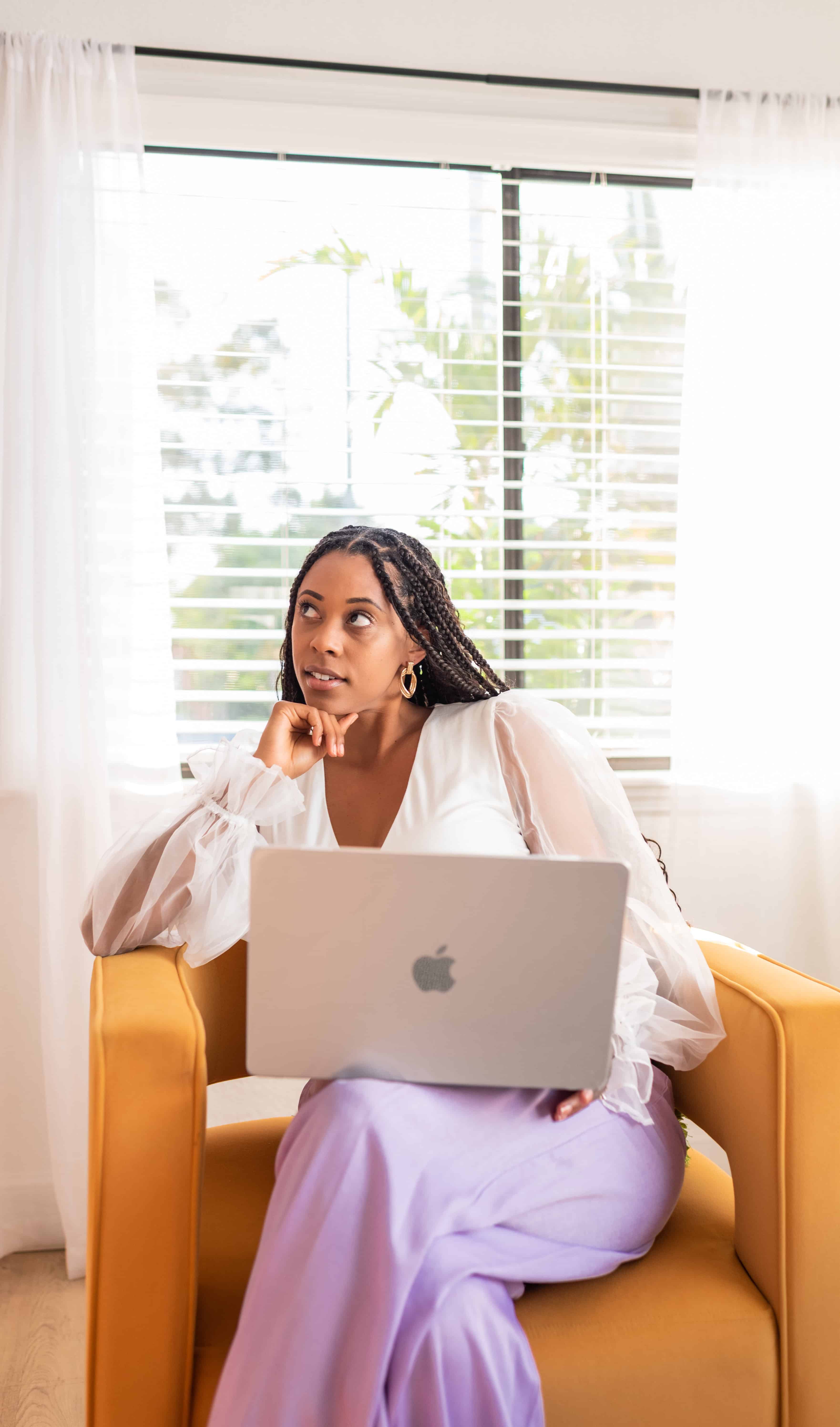 woman holding her laptop
