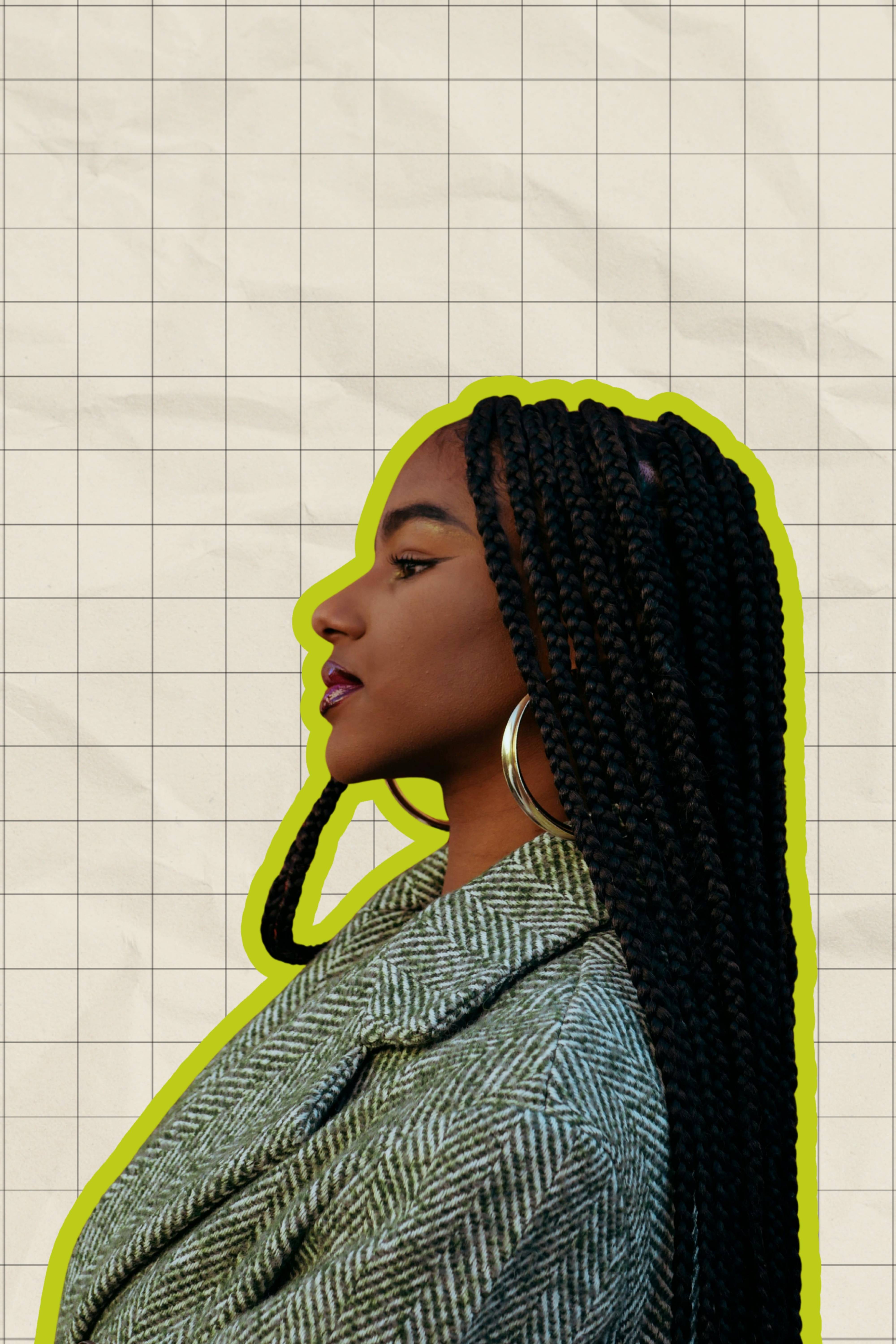 a woman with braids and hoop earrings looking off to the side