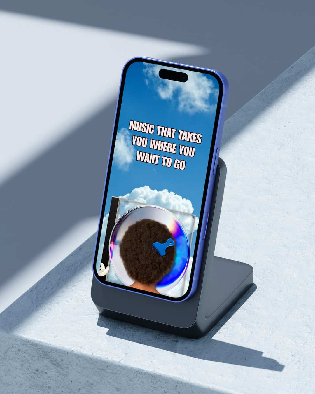 Blue iPhone on stand showing text 'Music that takes you where you want to go' with afro hair image.