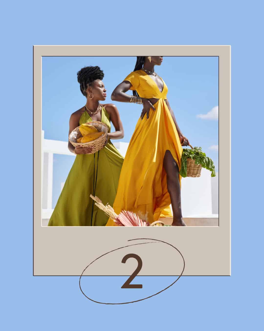 Two Black women outdoors in yellow and green dresses holding baskets with fruits and greens.