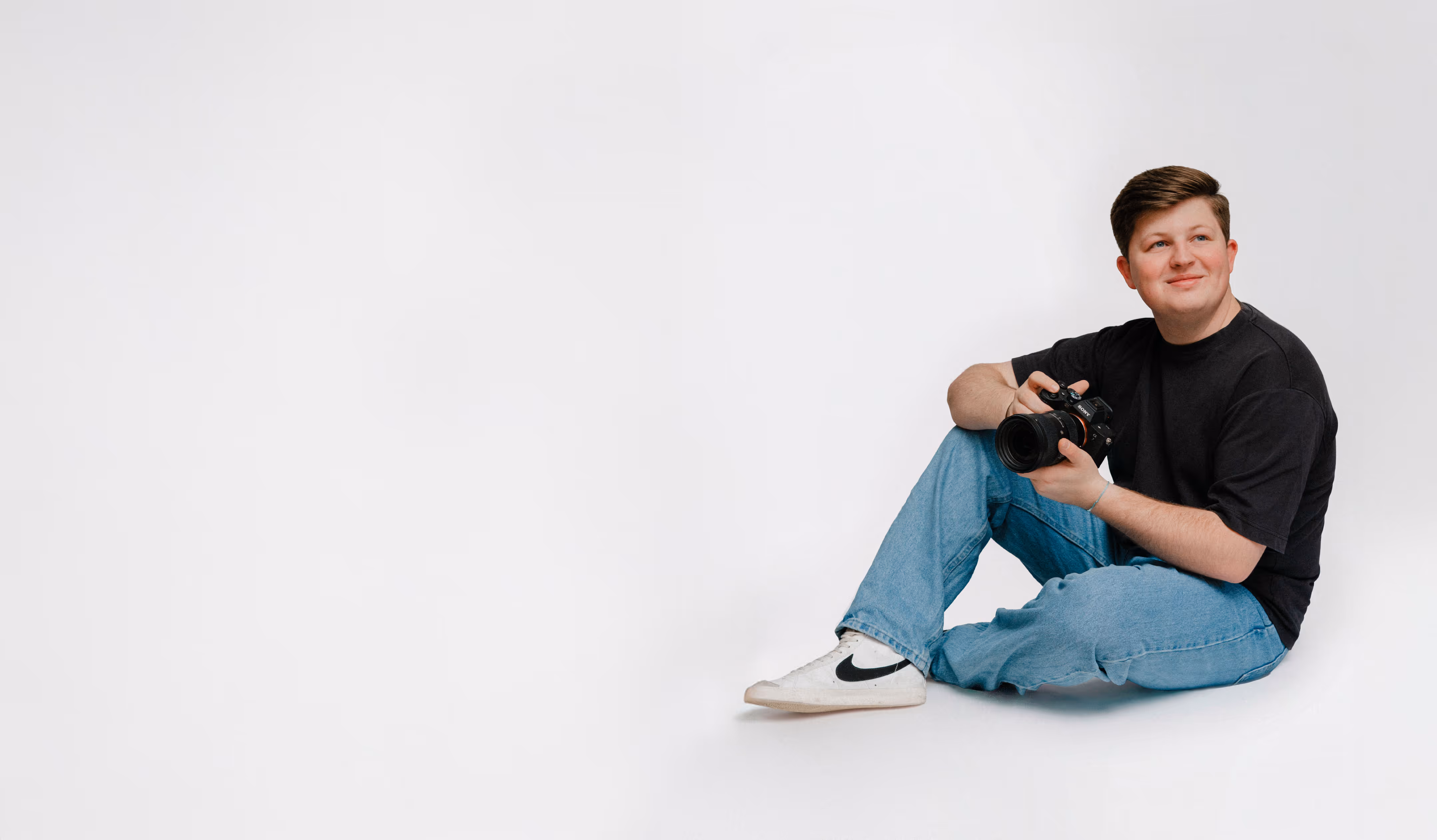 A studio portrait of Luke Impson, a photographer and owner of Luke Impson Photography.