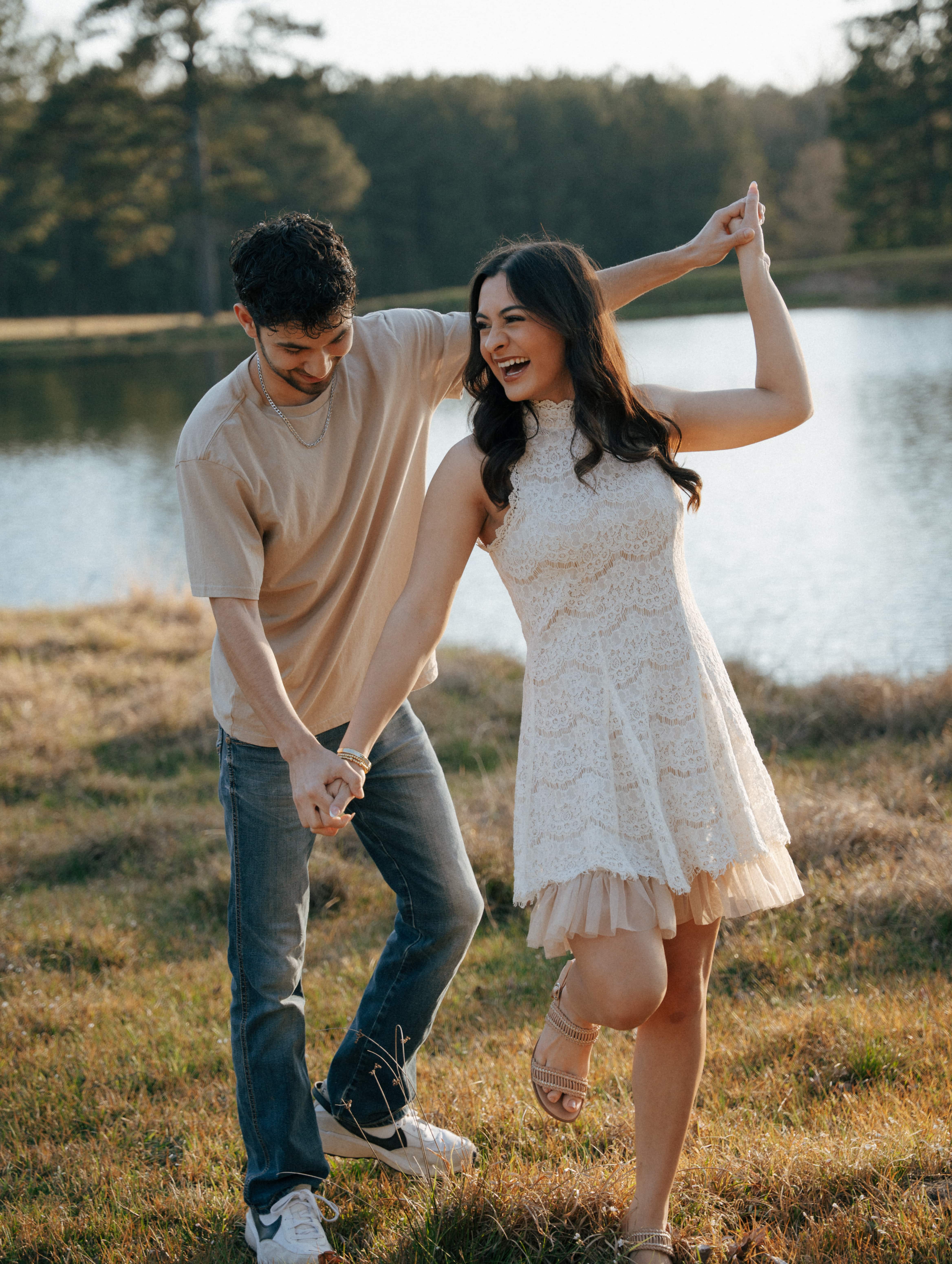 Smiling couple laughing in a field
