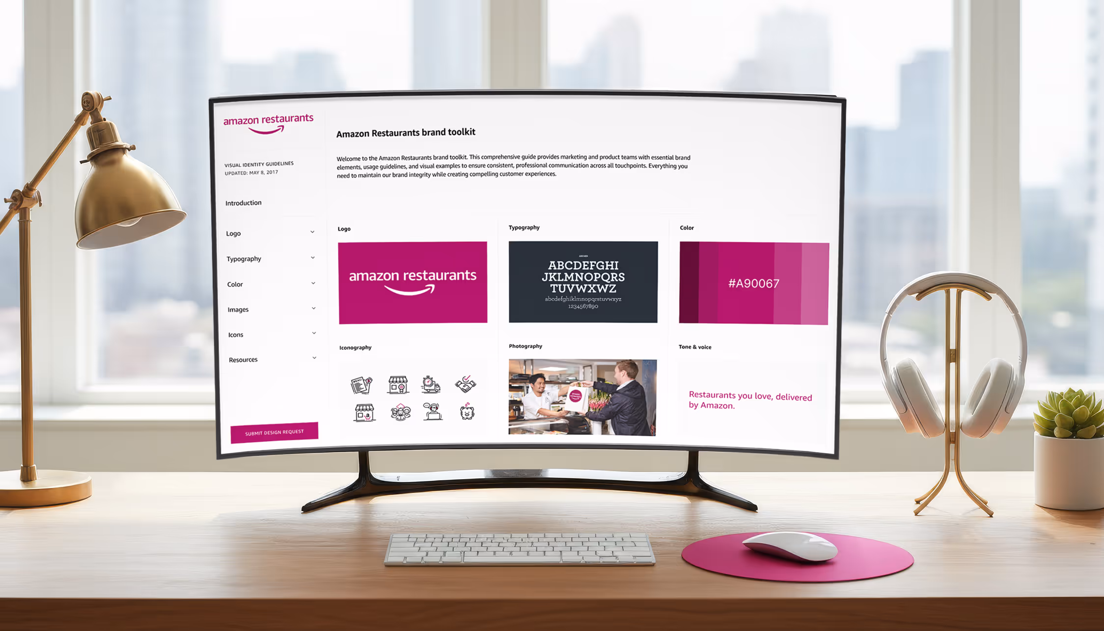 Computer monitor displaying Amazon Restaurants brand toolkit with logo, typography, color palette, and iconography guidelines.