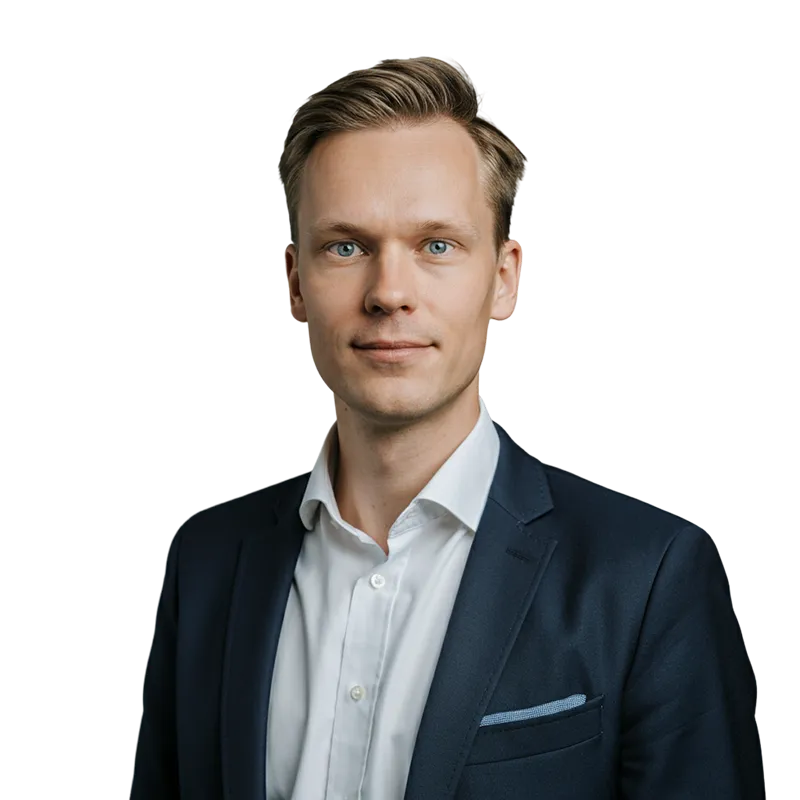 Portrait of a young man with light brown hair wearing a dark suit jacket and white shirt against a transparent background.