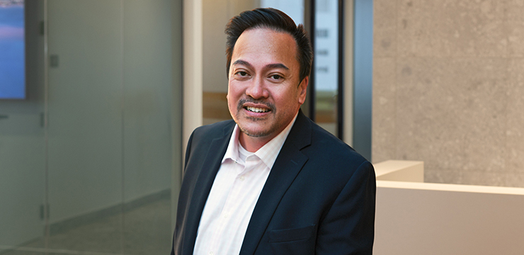 Smiling man with blazer and dark hair