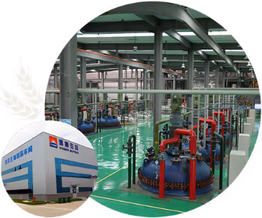 Industrial manufacturing facility interior with blue and red machinery and green flooring, inset image shows exterior of the facility with company name in Chinese.