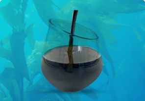 A clear glass with a dark liquid and a black straw inside, set against a blue underwater-like background with silhouettes of sea creatures.
