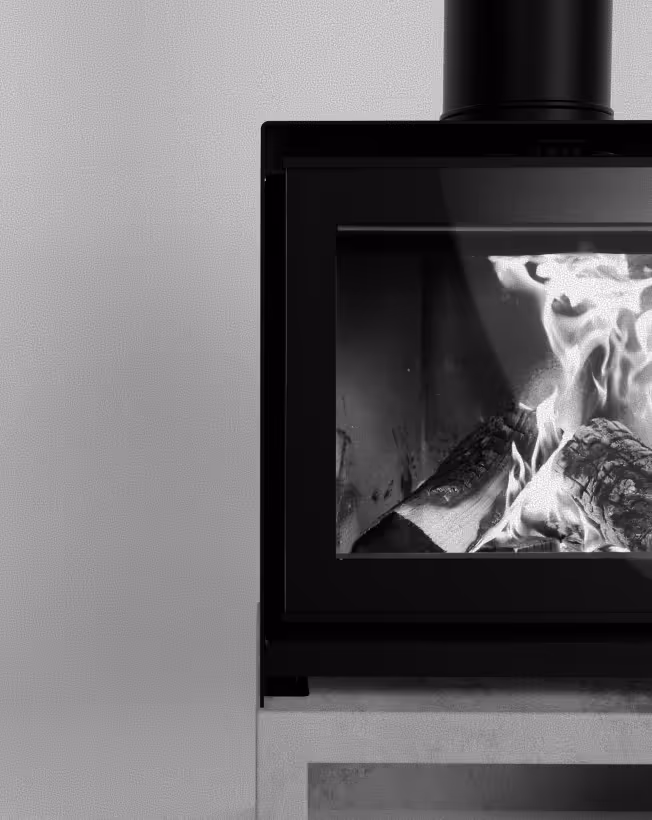 Close-up of a modern black wood-burning stove with visible flames inside.
