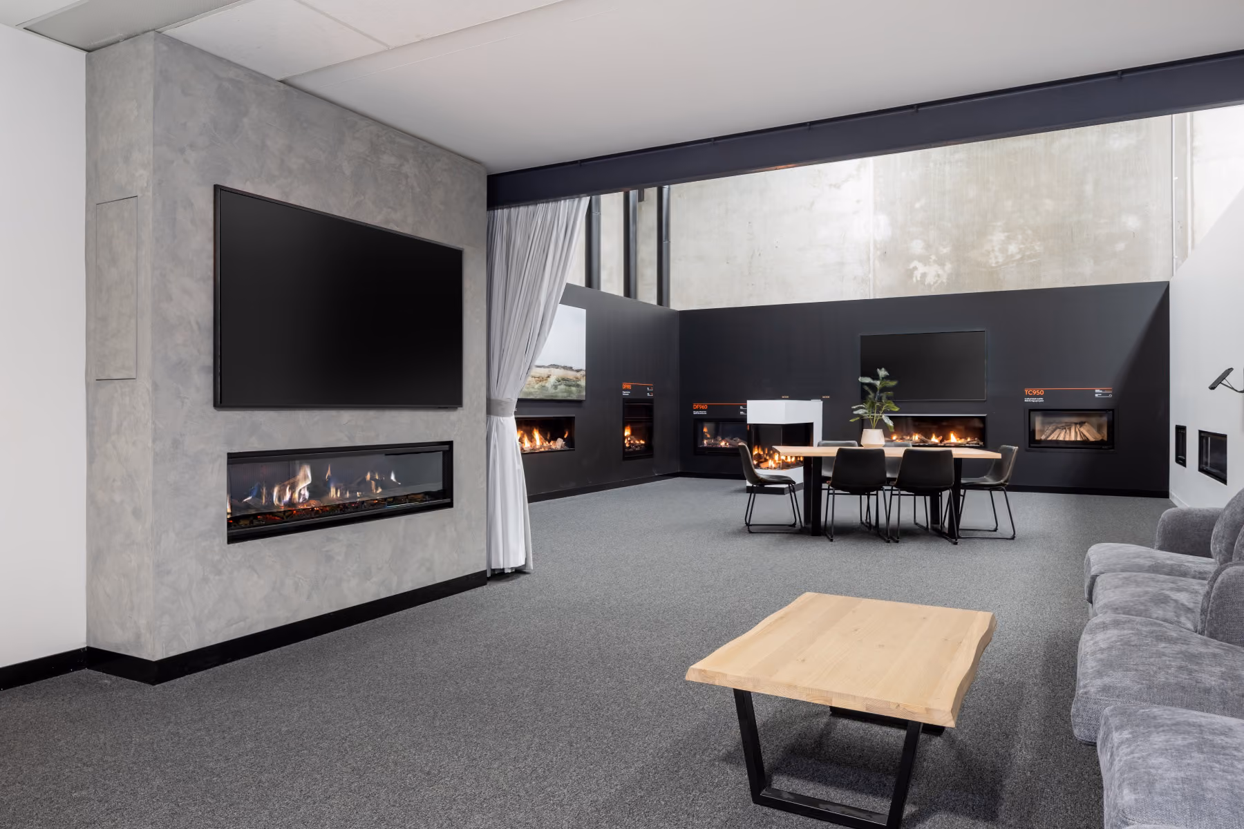 The Fireplace Training & Selection Centre is a Modern showroom with multiple  fireplaces. 