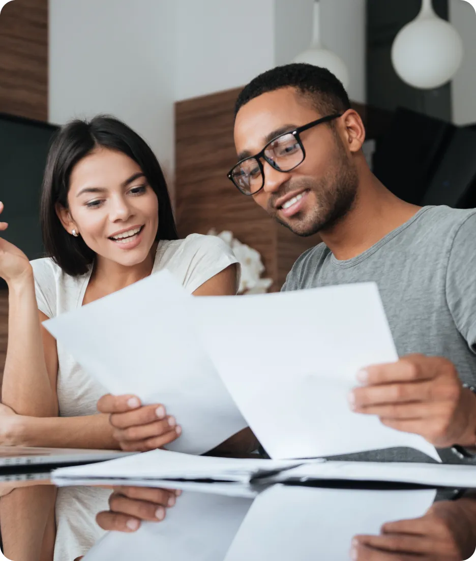Two people staring at spreadsheets
