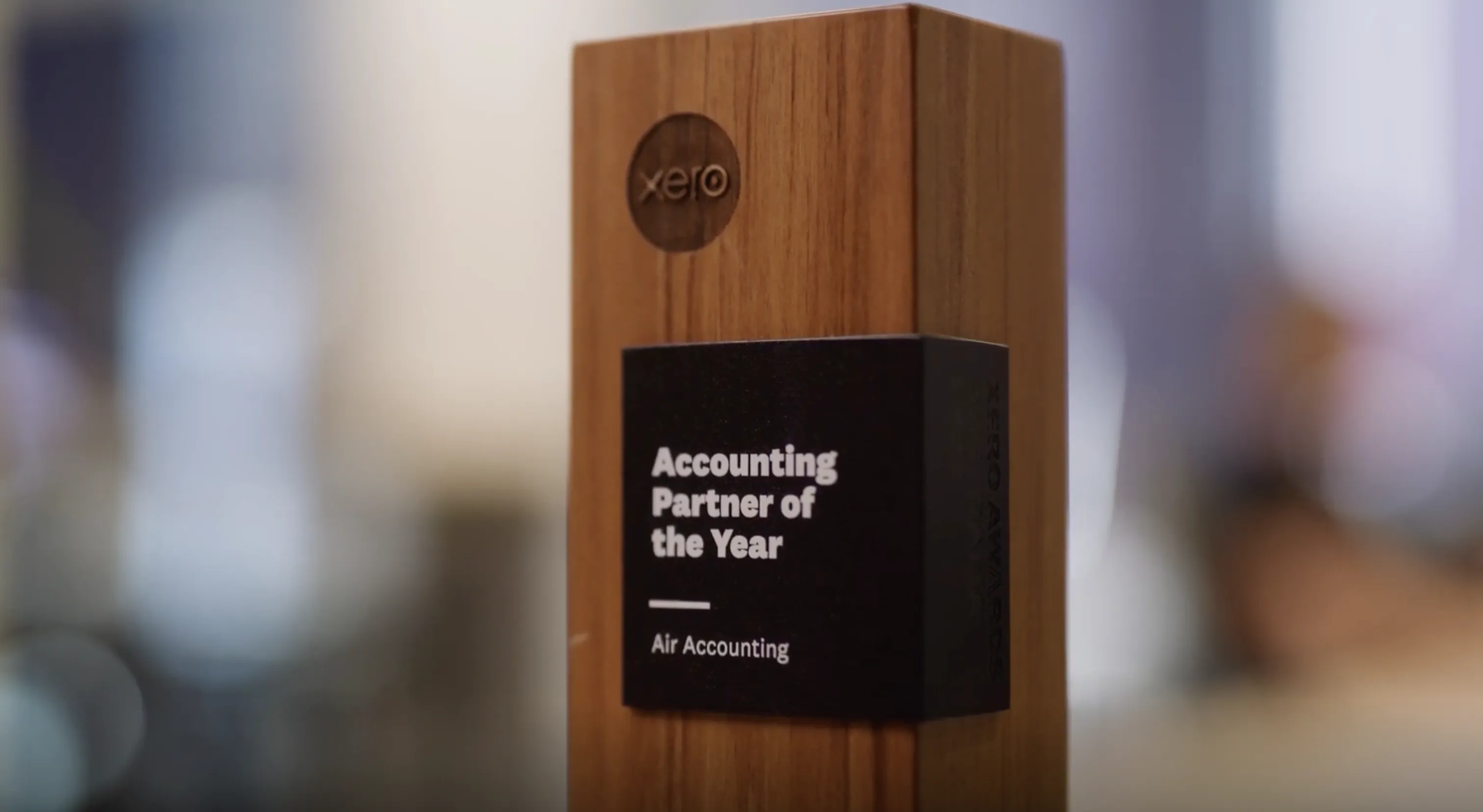 A close up of a wooden block with a sign on it.